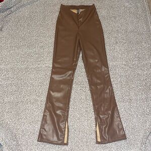 H&M brown leather flair pants with slits at bottom. Size US 2